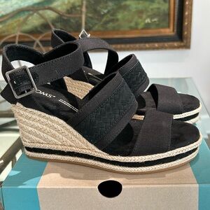 Tom’s black canvas/ embossed braided heels. Never worn. Size 5.